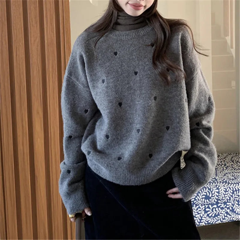 Women's loose fit acrylic pullover sweater with crew neck and embroidery details