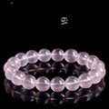 Natural starlight crystal women's bracelet with polished pink round beads in single circle design