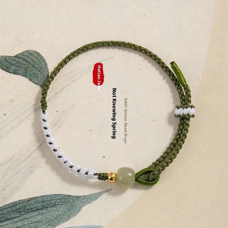 Women's Chinese national bracelet with Hetian jade, sterling silver, and colourful cord carrying strap