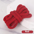 A pair of black oval shoelaces with round profile next to colour swatches showing pink, blue, gray, and orange options.