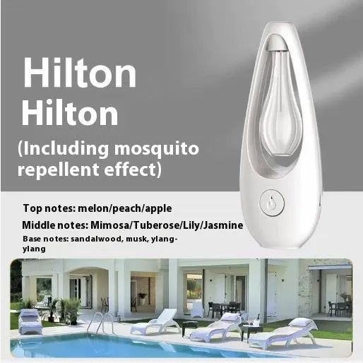 Ultrasonic aroma diffuser with mosquito repellent in a compact plastic design on a table, with essential oil bottle beside it
