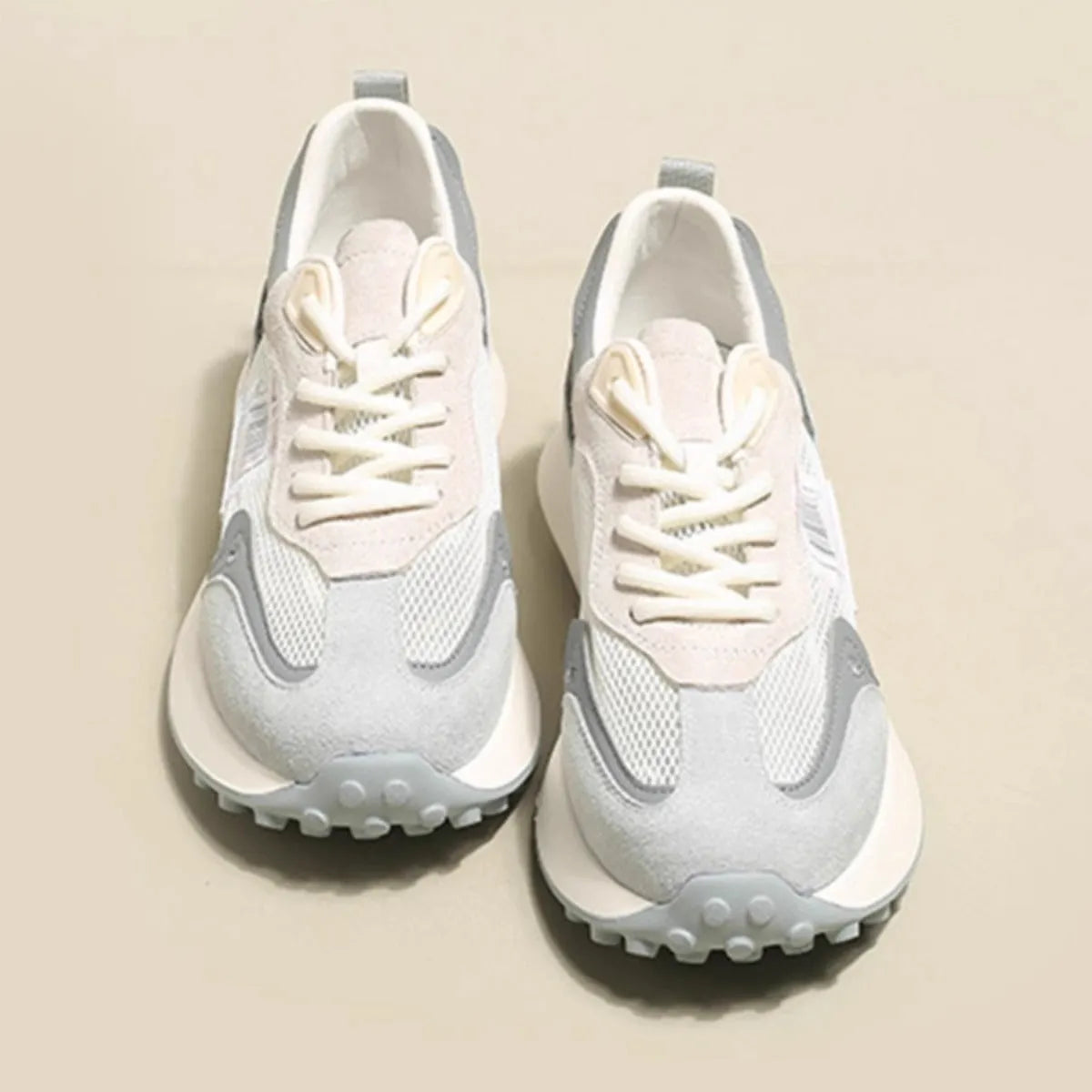 Women's grey and pink retro sneakers with low-top design and round toe