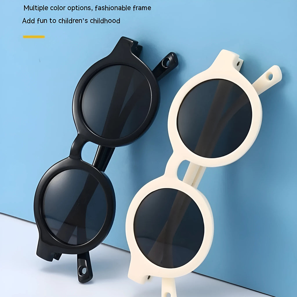 Round frame polarised sunglasses for toddlers aged 0-3 years with UV400 protection, shown in multiple colour options.