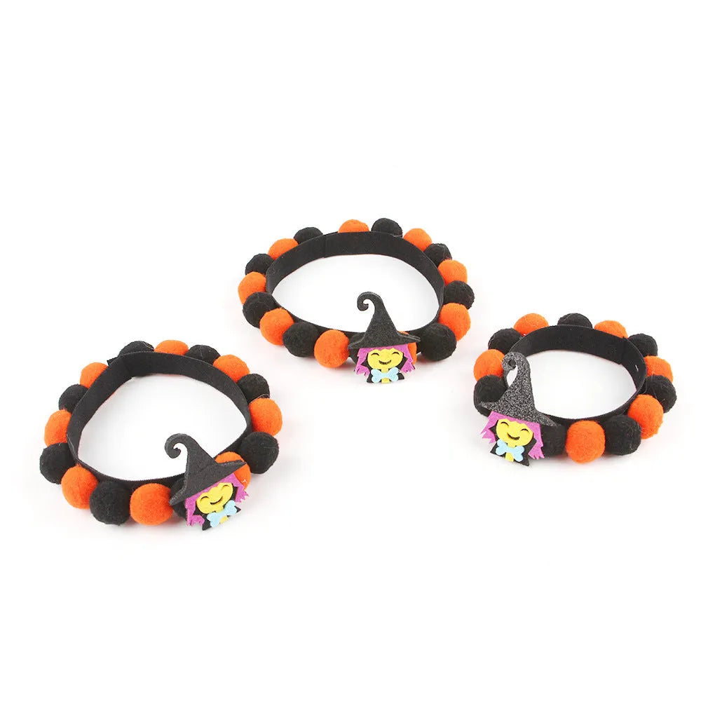 Halloween pet fur ball collar in pumpkin orange colour with fluffy ball on a black collar