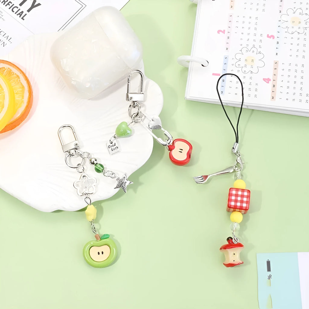 Fruit-shaped mobile phone bag pendant keychain in plastic resin with apple and strawberry design, half-handmade finish, multiple colour options