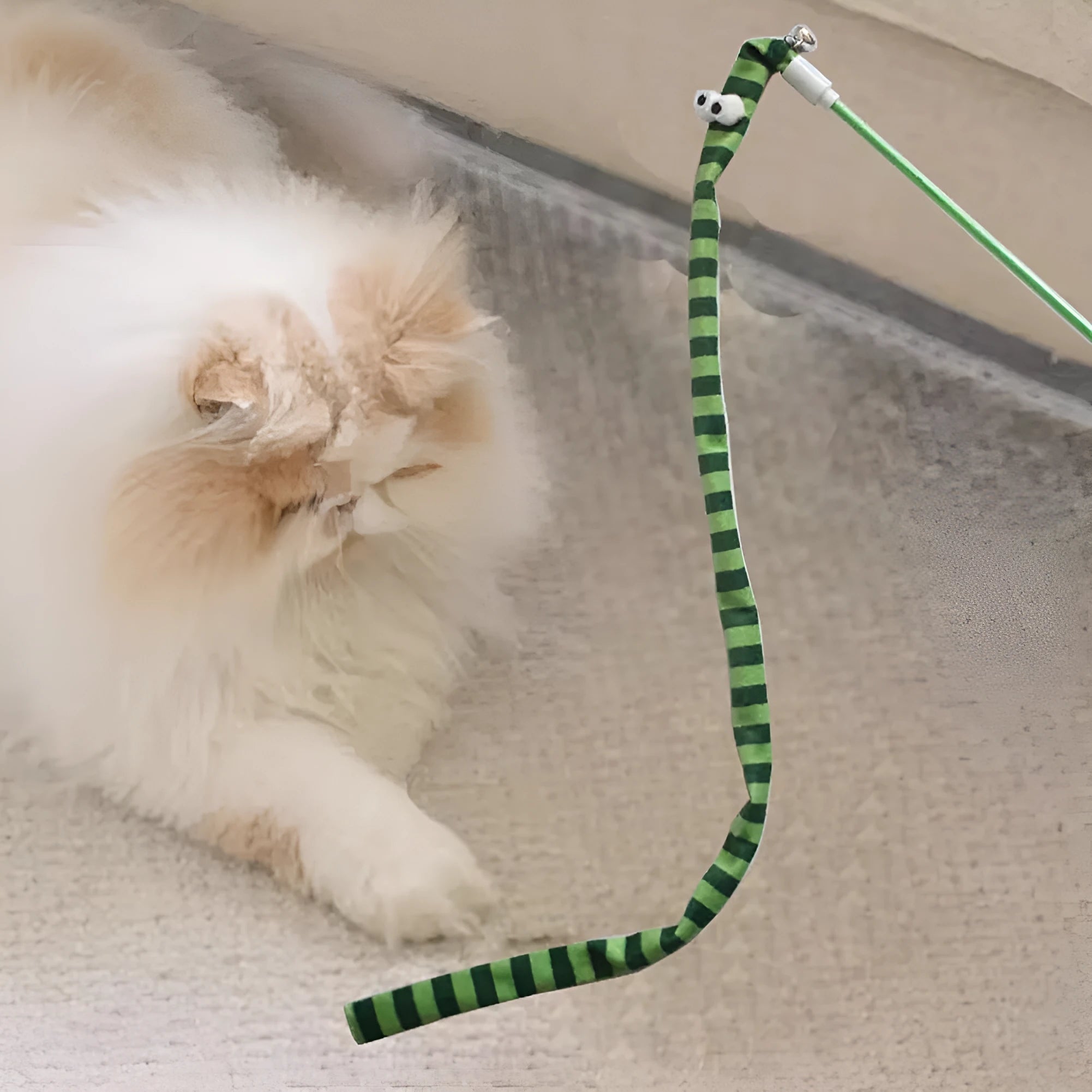 Colourful cat teaser wand with a long plush strip and bell on a polycarbonate pole.