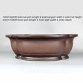 Handmade antique crabapple shaped purple clay flowerpot measuring 74x61x23cm.
