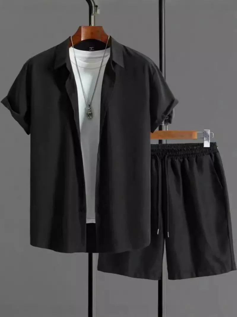 Men's black and white Jacquard print short sleeve suit with matching shorts on a hanger.