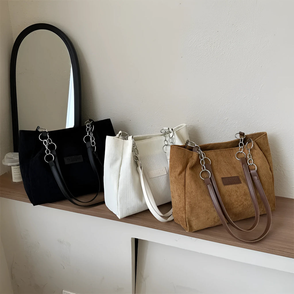 Corduroy one-shoulder large capacity tote handbag for women in black, brown, and white with outer pocket