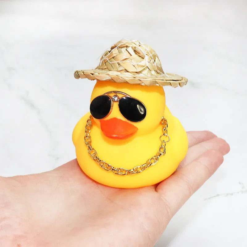Yellow cartoon duck with straw hat car dashboard ornament on adhesive base with sunglasses necklace