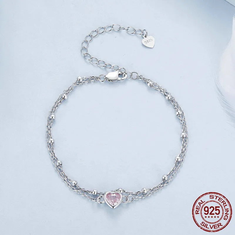 Sweet girlish sterling silver bracelet with a small heart-shaped pendant on an adjustable chain.