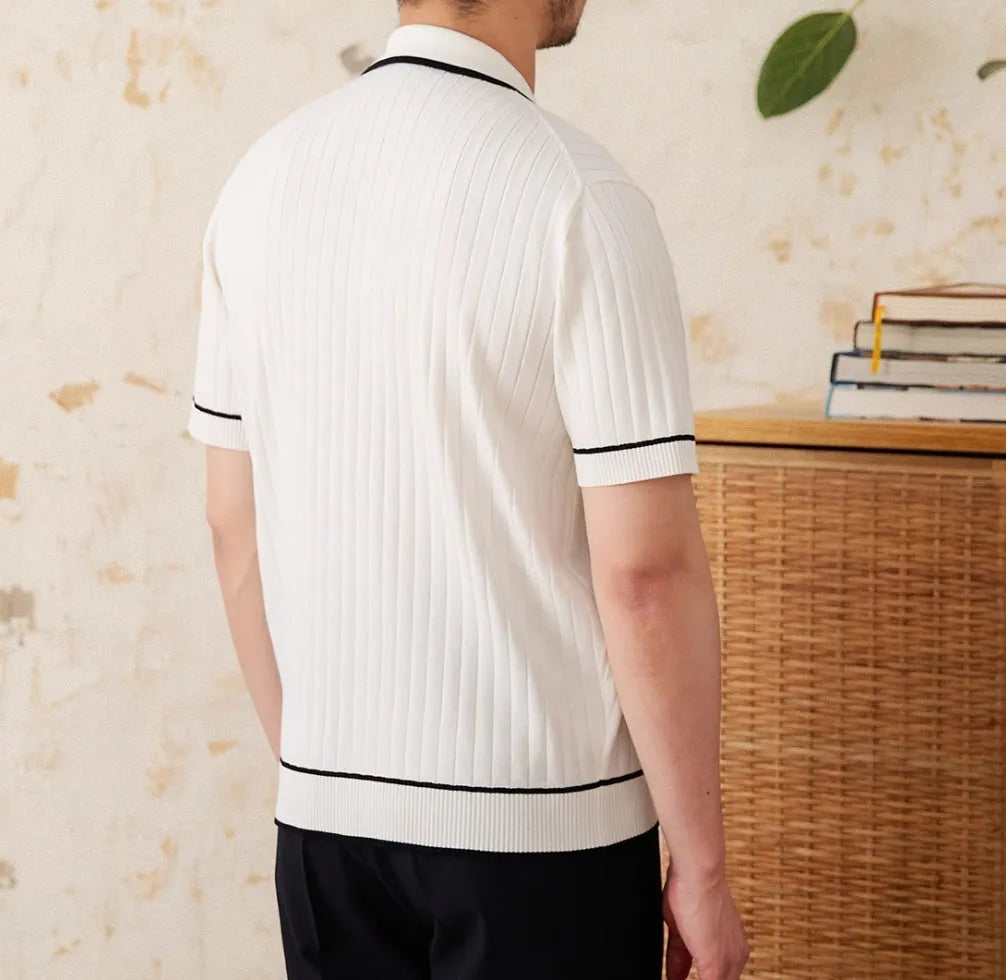 Slim-fit black lapel polo shirt with short sleeves on a hanger, showing elastic knitted texture.