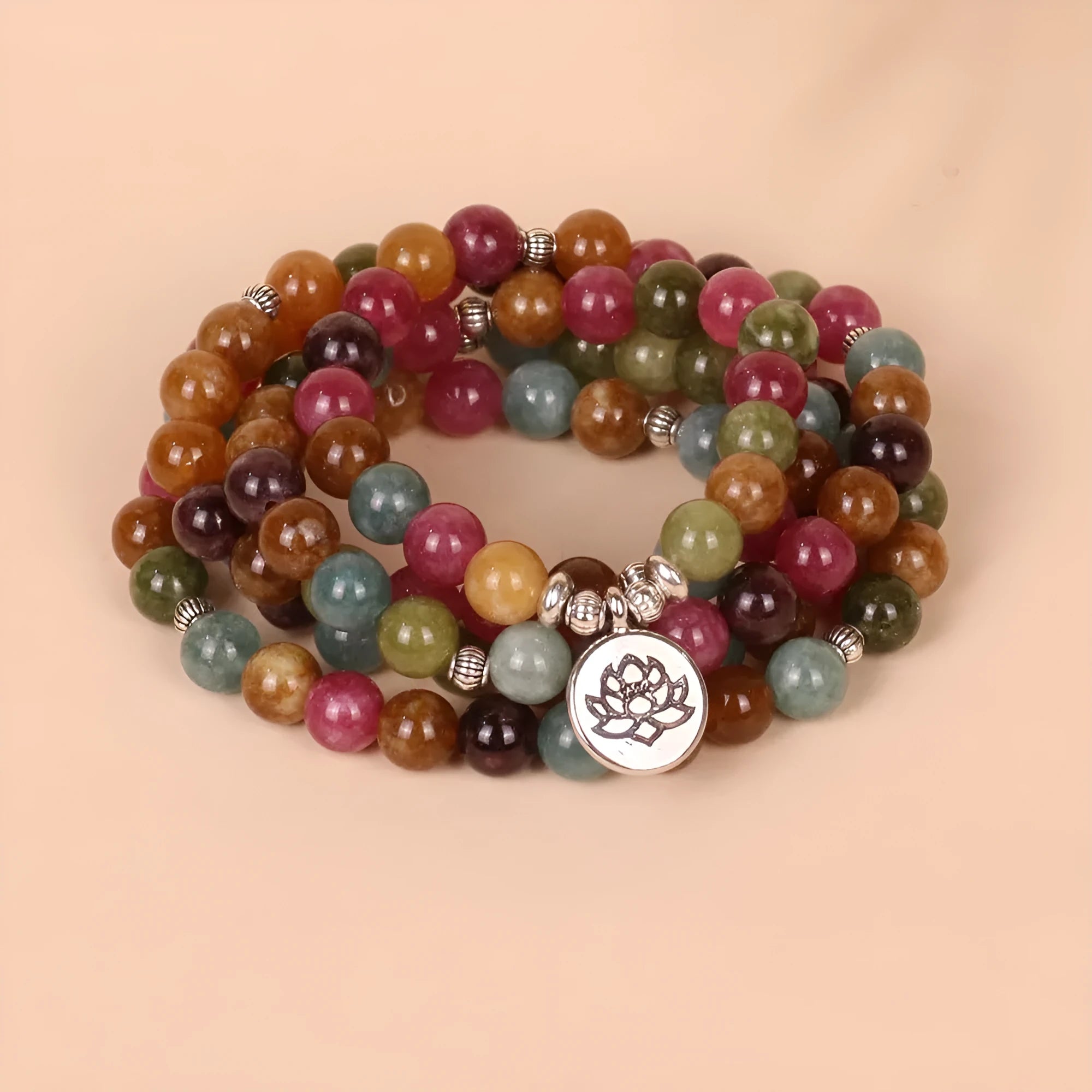 Multi-strand bracelet with 108 natural tourmaline beads and lotus charm on alloy chain