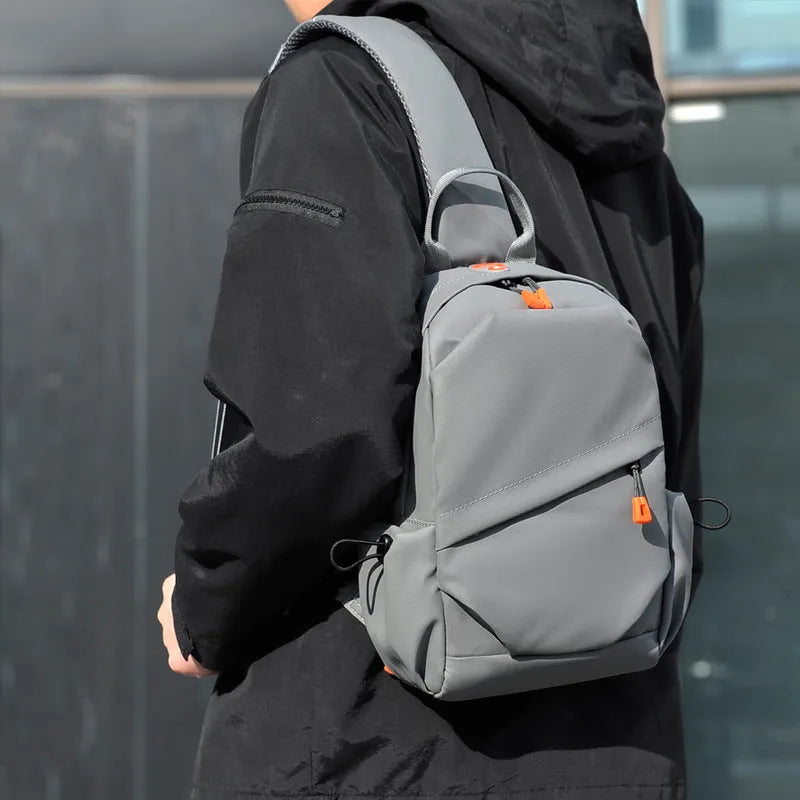 Men's black waterproof polyester crossbody bag with simple casual design