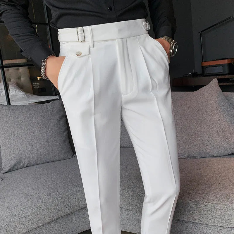 Men's straight-leg casual trousers in solid colours including black and grey, laid flat.