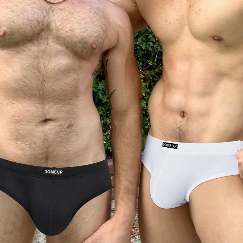 Men's solid colour low-waist seamless briefs in white, black, and pink options