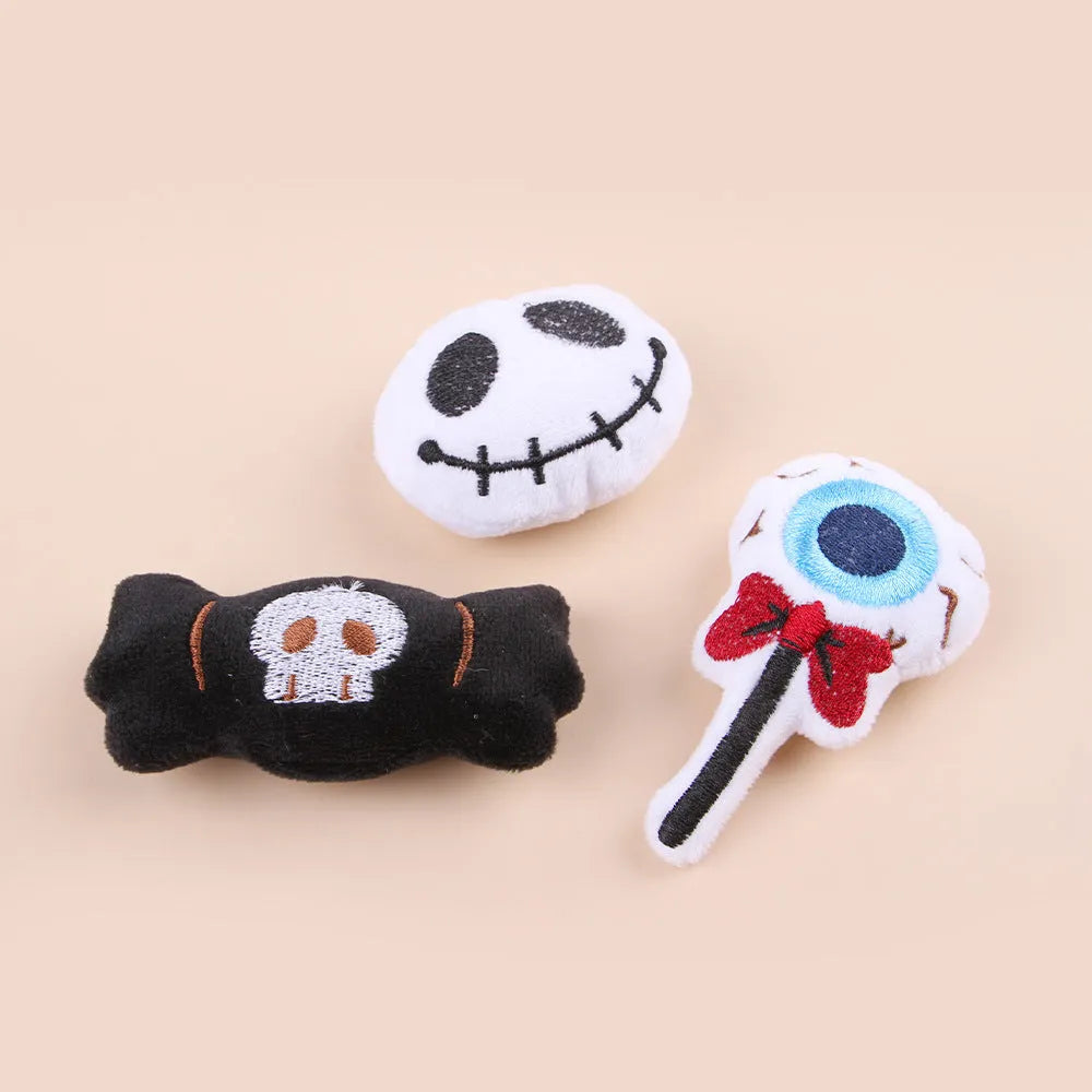 Plush cat teaser wand toy with colourful candy and skull designs on small attachment
