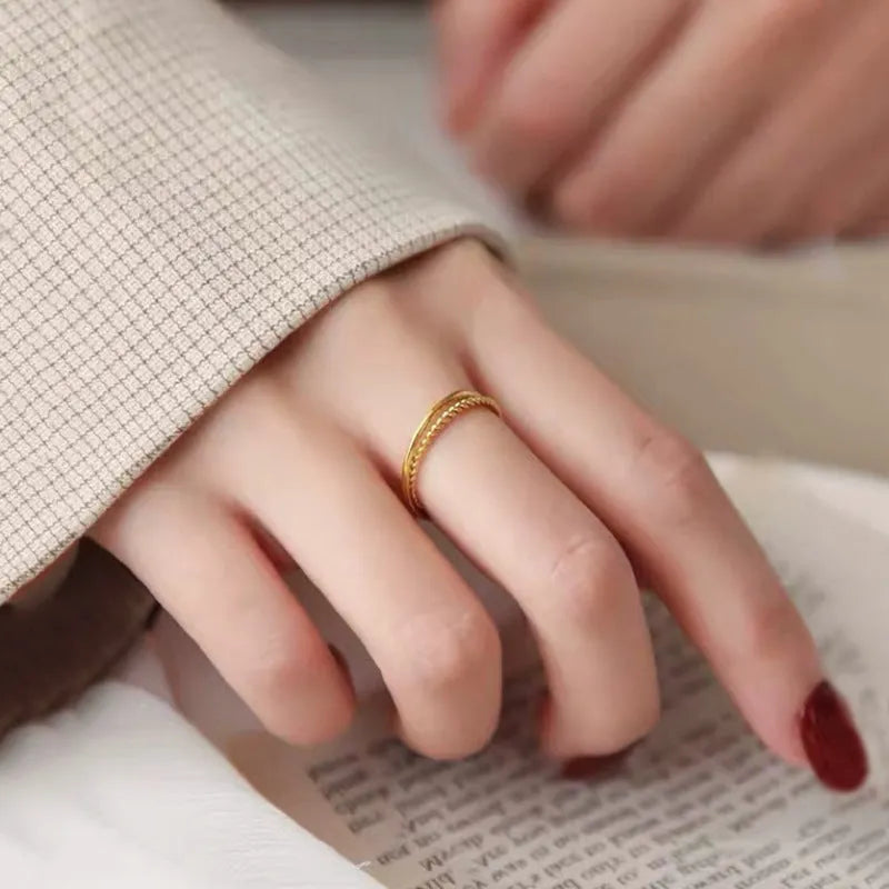 Simple bracelet brass gold plated ring in glossy finish on white background