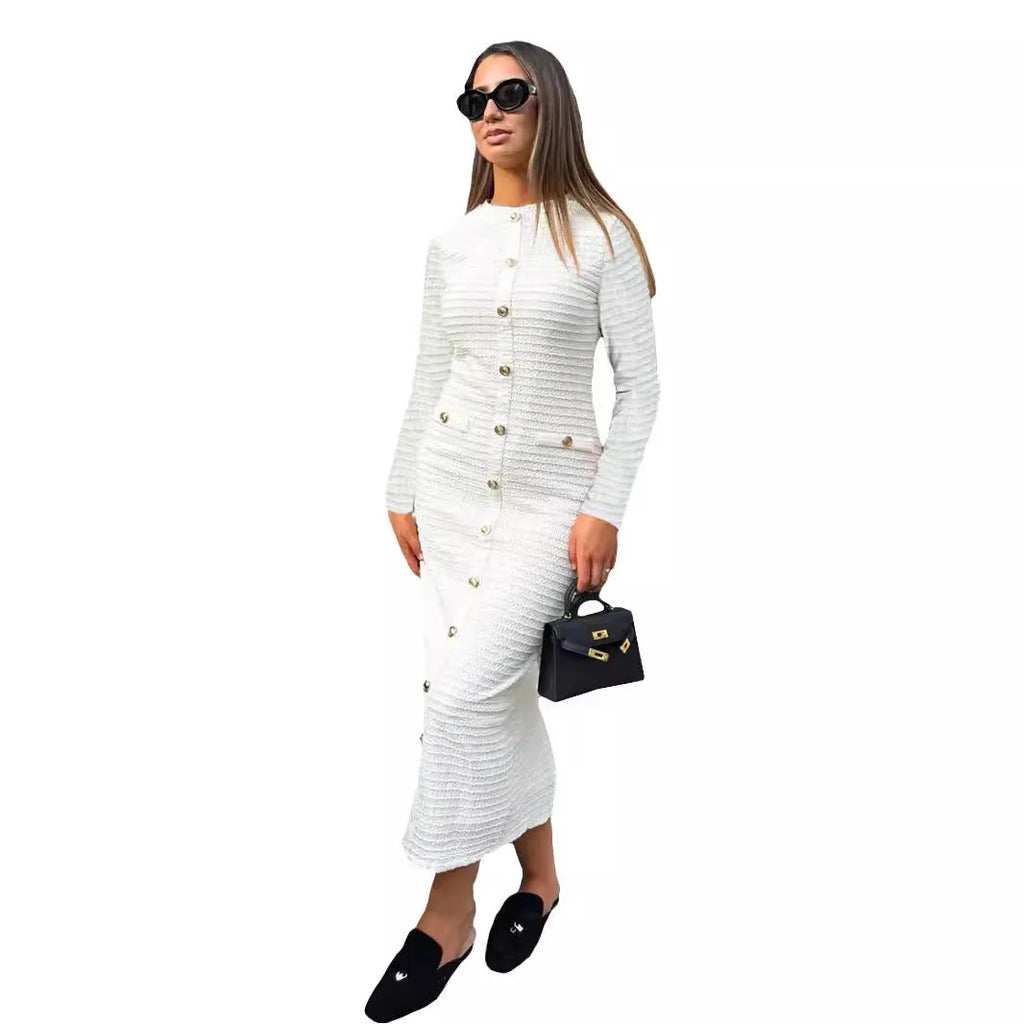 Black and white French retro slim fit knitted long-sleeved dress with button detail.