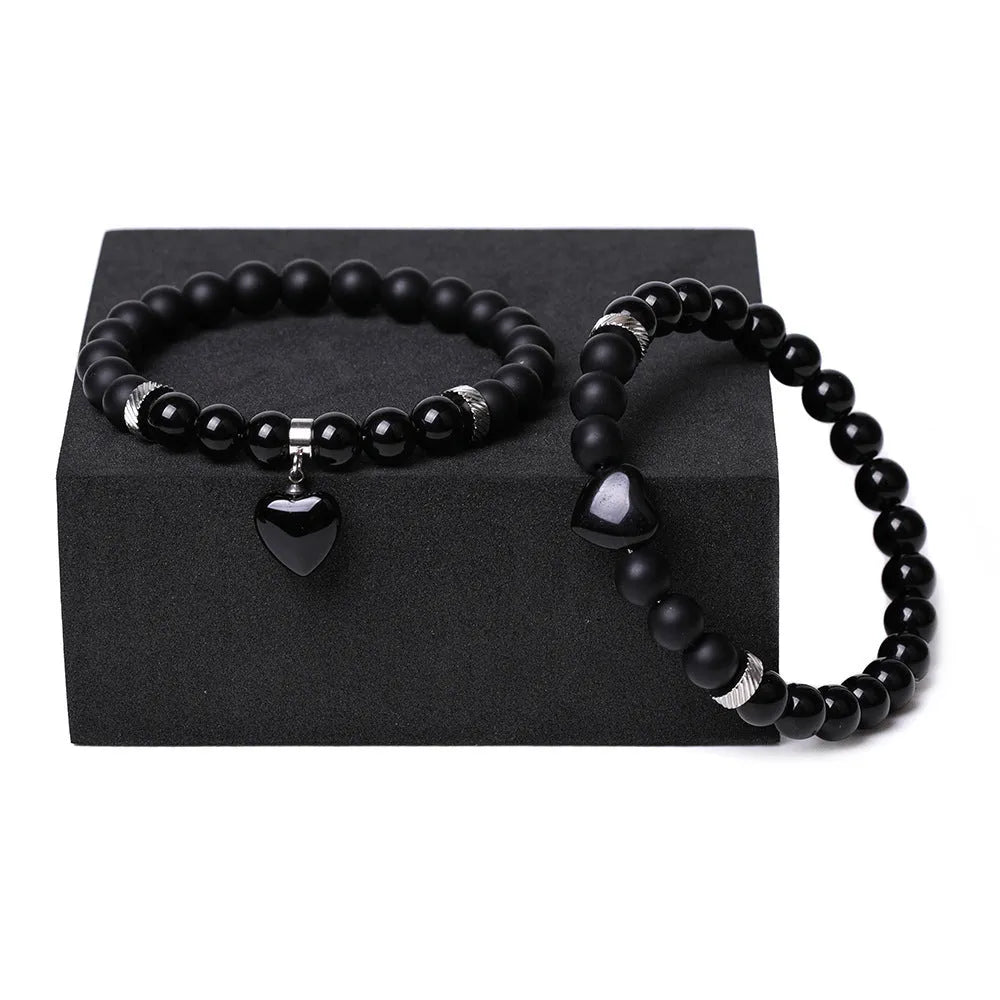 Set of two polished natural stone heart-shaped bracelets for couples in matching colour