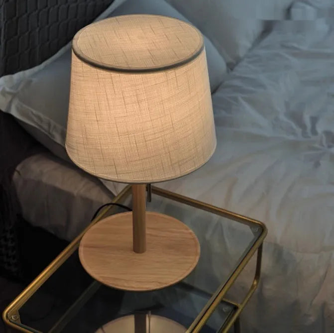 Walnut solid wood bedside lamp with cloth lampshade on wooden table