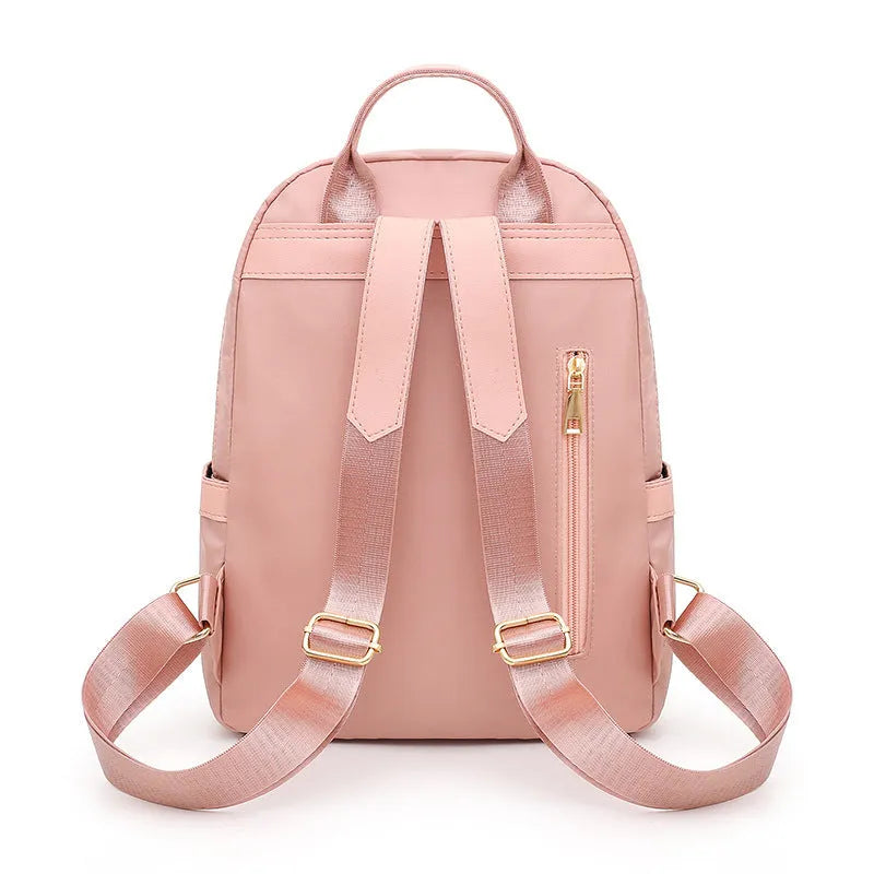 Black casual nylon backpack with shoulder straps showing internal organisation compartments