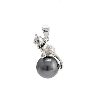 Close-up of a sterling silver cat pendant on a delicate clavicle chain necklace.