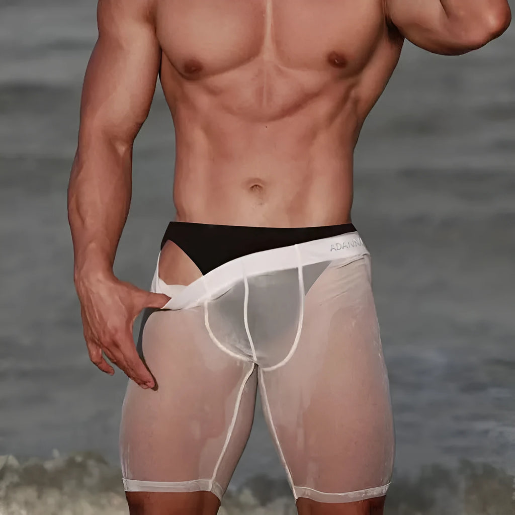 Men's solid colour mesh shorts in black, shown on a hanger, highlighting knitted fabric.
