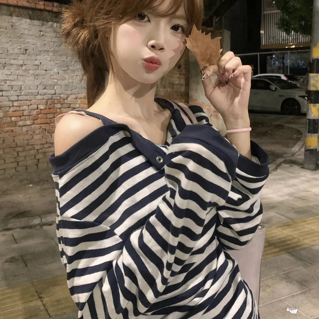 Dark blue Korean-style oversized women's T-shirt with embroidered stripes and button details on long sleeves