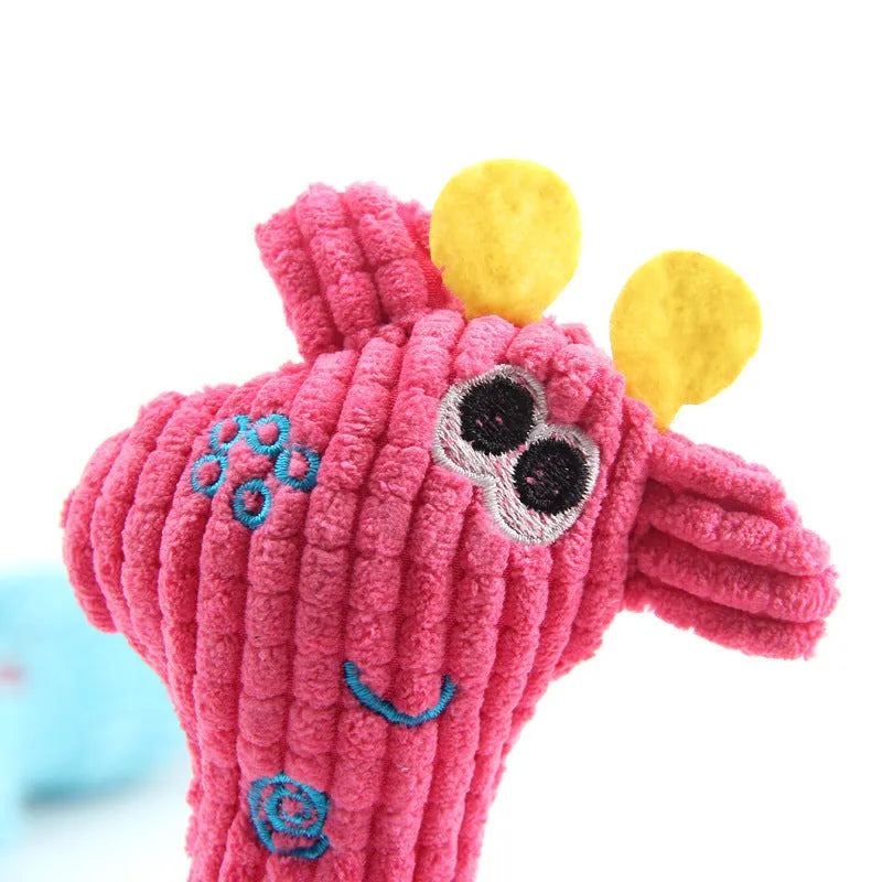 Deer-shaped plush pet toy with corn grain texture in blue, pink, and yellow colour options