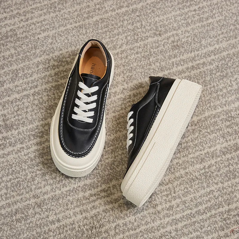Women's tied platform sports board shoes in black with round toe, cowhide upper, and rubber sole