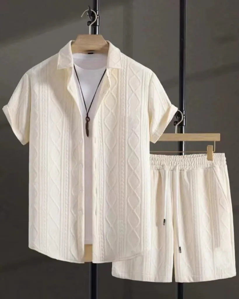 Men's black and white Jacquard print short sleeve suit with matching shorts on a hanger.