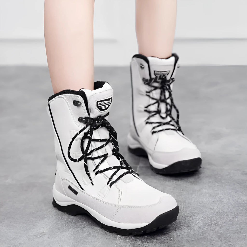 Women's genuine leather mid-calf thermal snow boots in black with round toe and rubber sole