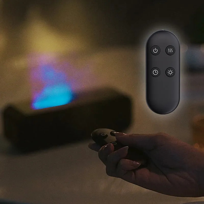 Black and white aroma diffuser with flame effect and colour-changing lights showing remote control
