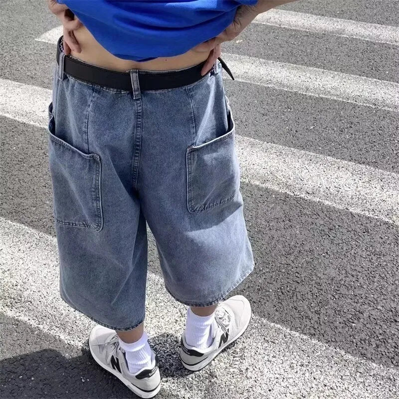 Blue men's denim pirate shorts with high waist, cropped length, and straight legs on a mannequin.