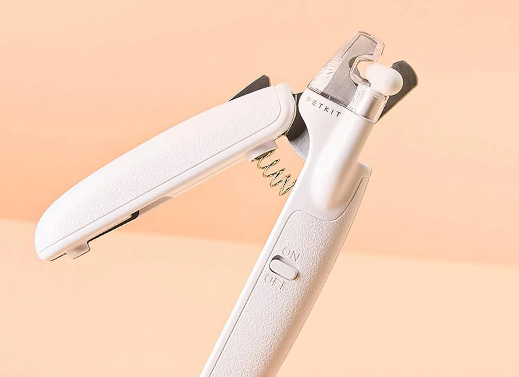 White LED pet nail clippers with transparent guard and triangular steel blade for dogs and cats