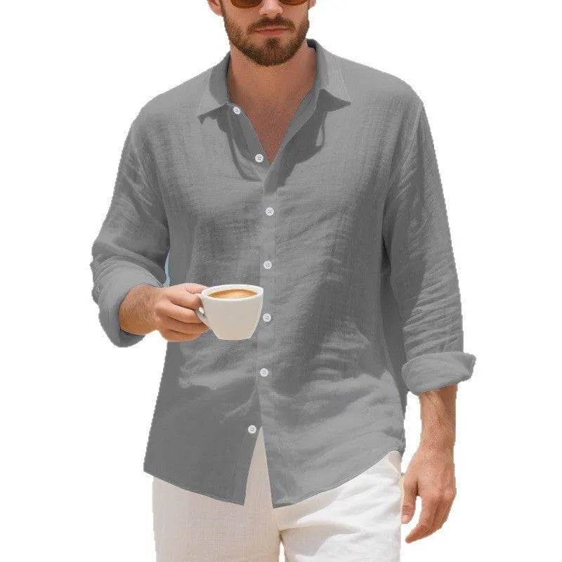 Loose-fitting linen casual shirt in light blue, showing long sleeves and non-ironed texture.