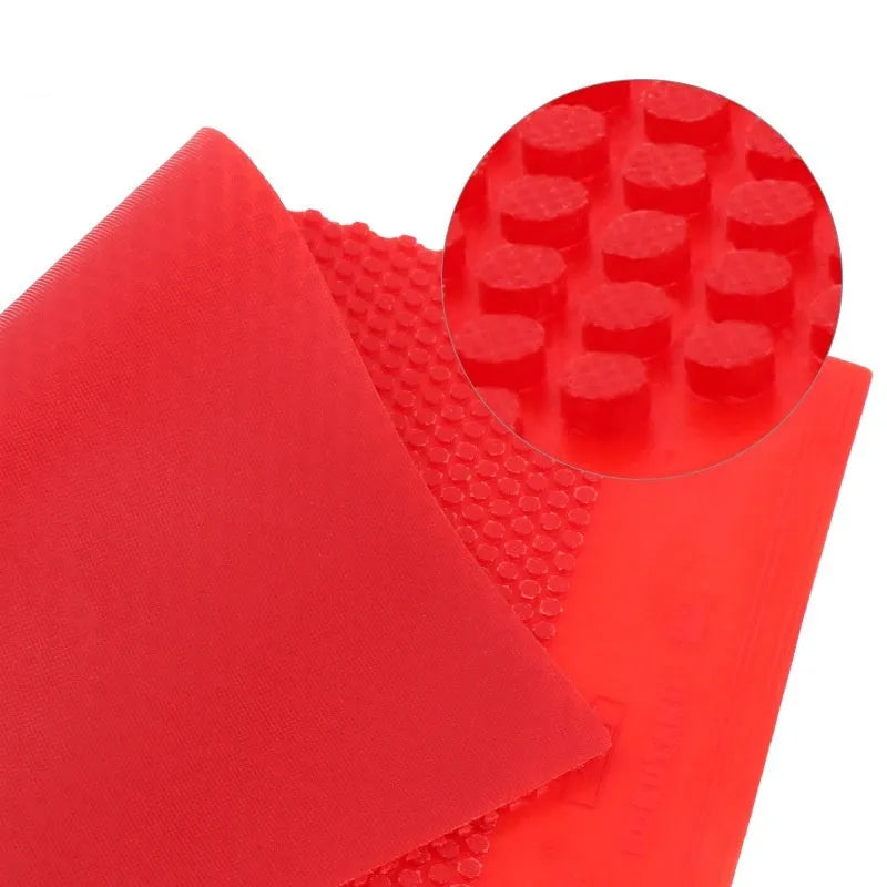 Single black and red table tennis rubber sheets with small particle texture for racket repair.