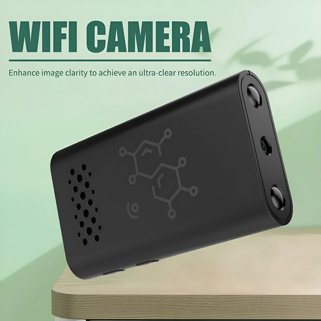 Black indoor smart security camera with WIFI and baby monitor functions on a table.