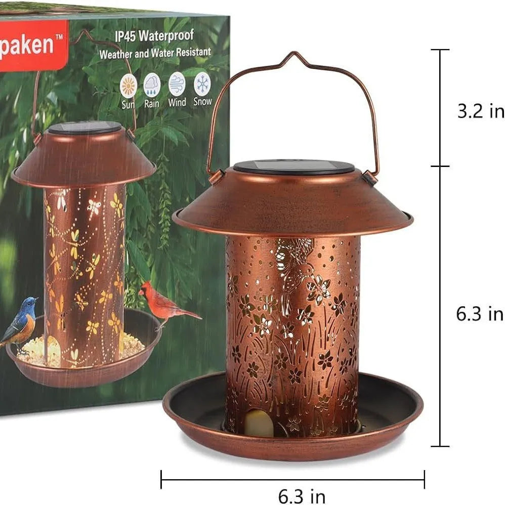 Cast iron solar bird feeder with hummingbird pattern and integrated LED lighting for outdoor garden use