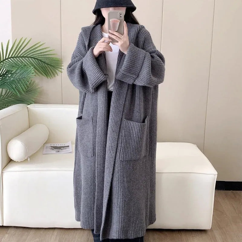 Women's loose hooded cardigan coat in acrylic fabric with raglan sleeves showing front opening