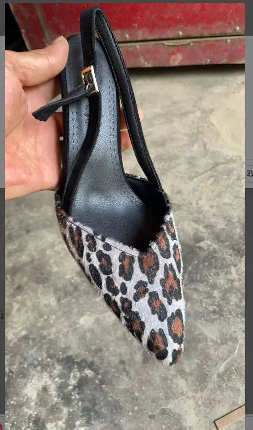 Women's leopard print suede pointed toe high heel sandals on a white background.