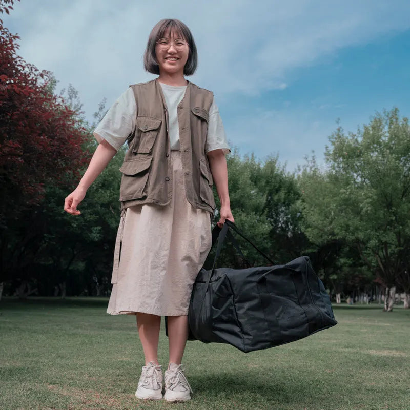Large black waterproof storage bag for camping tents and folding chairs, shown with size dimensions.