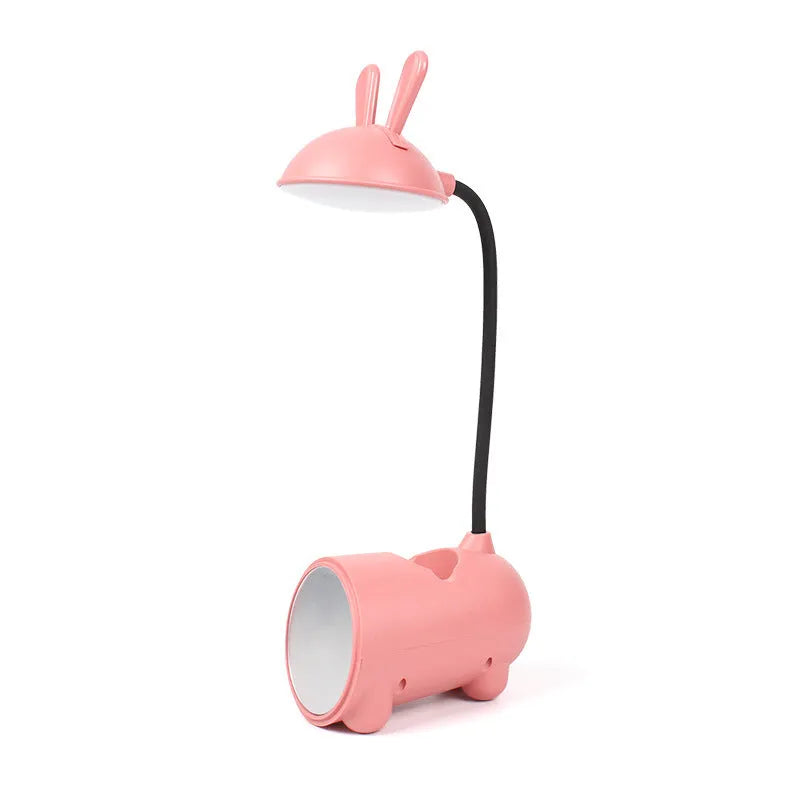 Cartoon-themed USB table lamp with pen container in green colour on desk