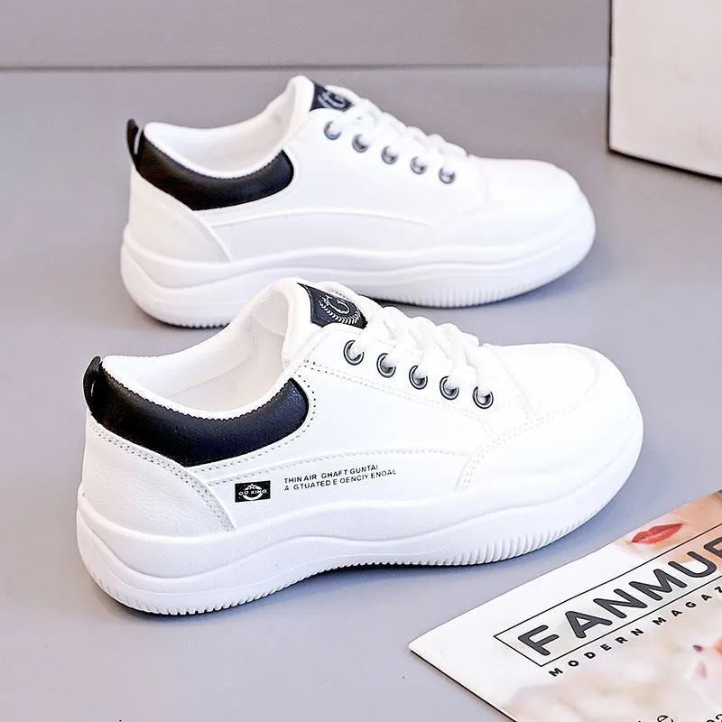 Women's white Korean style pumps with cross straps and lace-up design showing round toe and mid heel