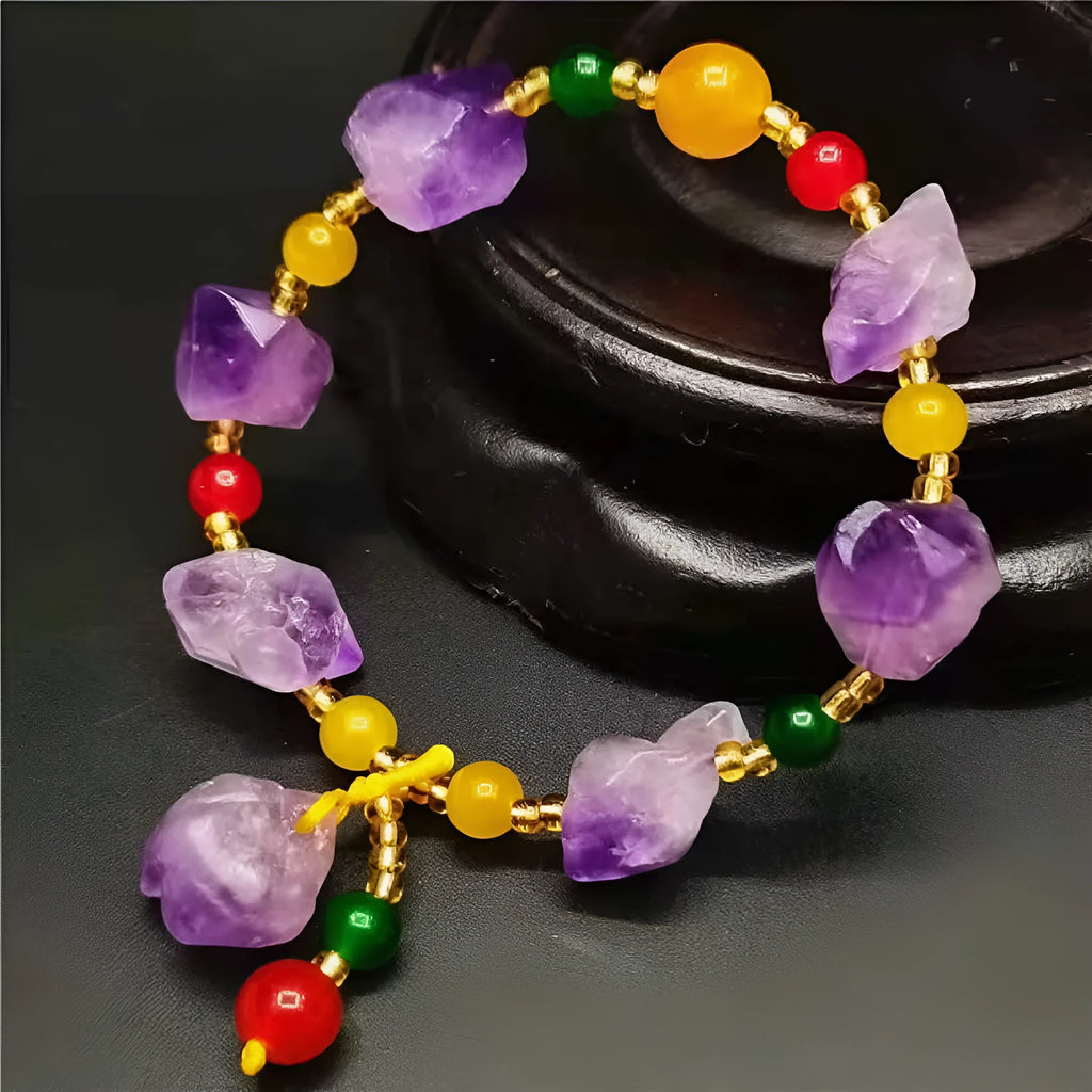 Natural shaped purple amethyst gemstone bracelet with a carved Fu character charm.