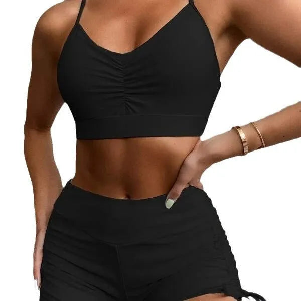 Women's high-waist split bikini swimsuit in solid black and purple colours showing two-piece design