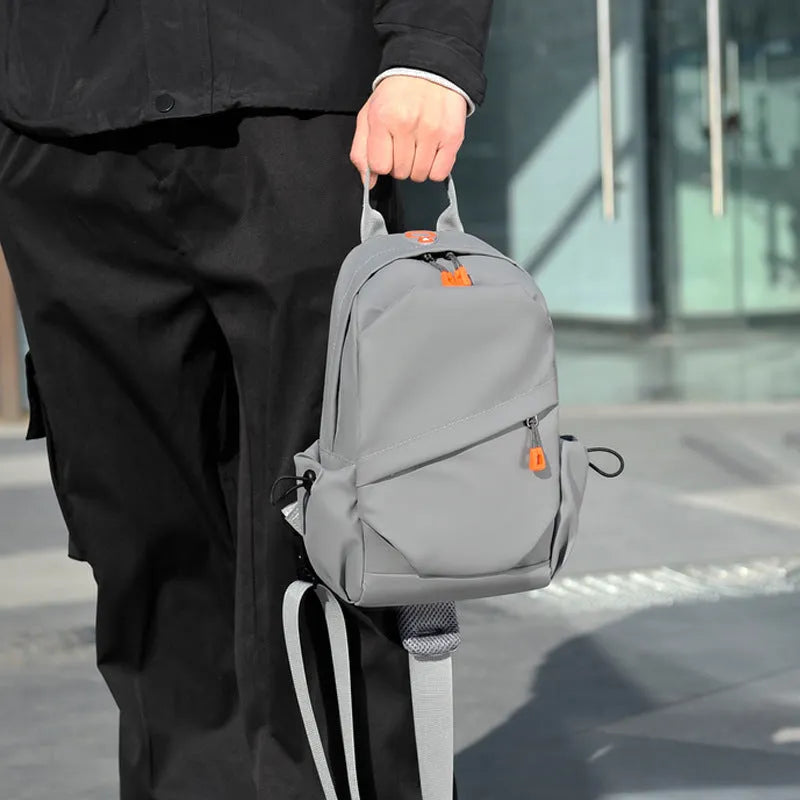 Men's black waterproof polyester crossbody bag with simple casual design