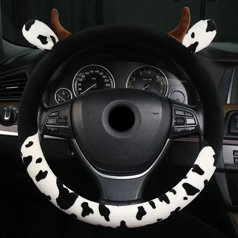Short plush steering wheel cover for cars in black colour showing textured surface