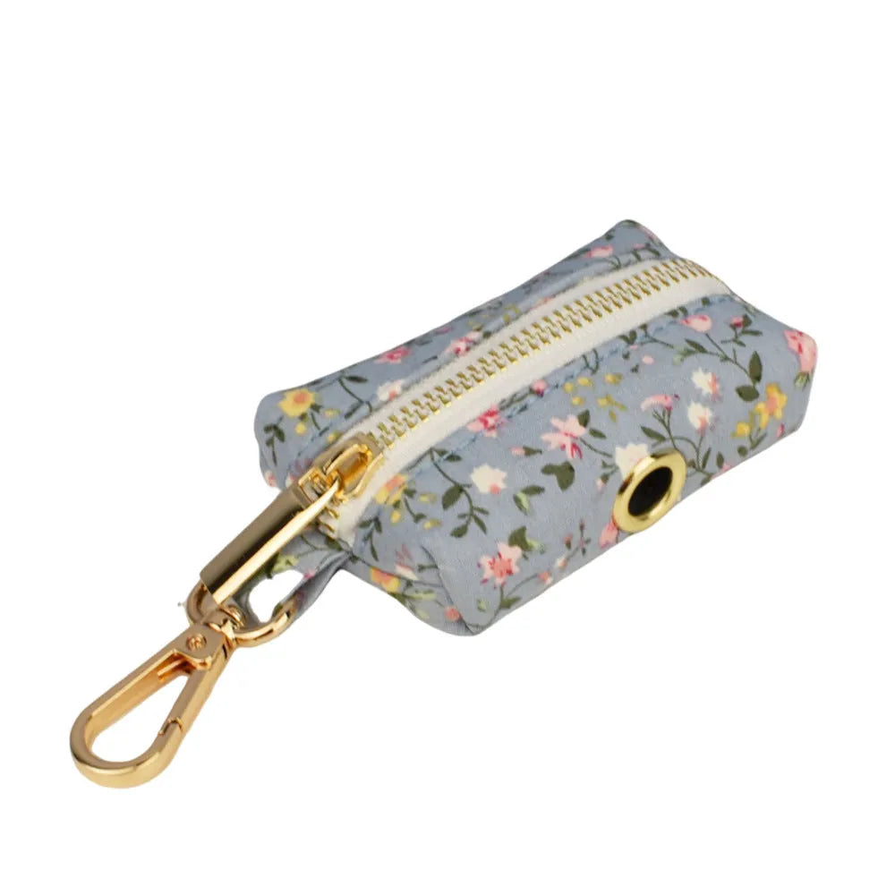 Blue floral polyester cotton dog collar set with matching leash, bow, vest, and poop bag accessories